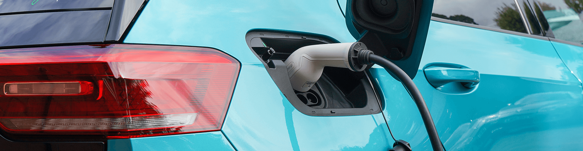 An electric vehicle connected to a charging station, ready to recharge its battery for sustainable driving.